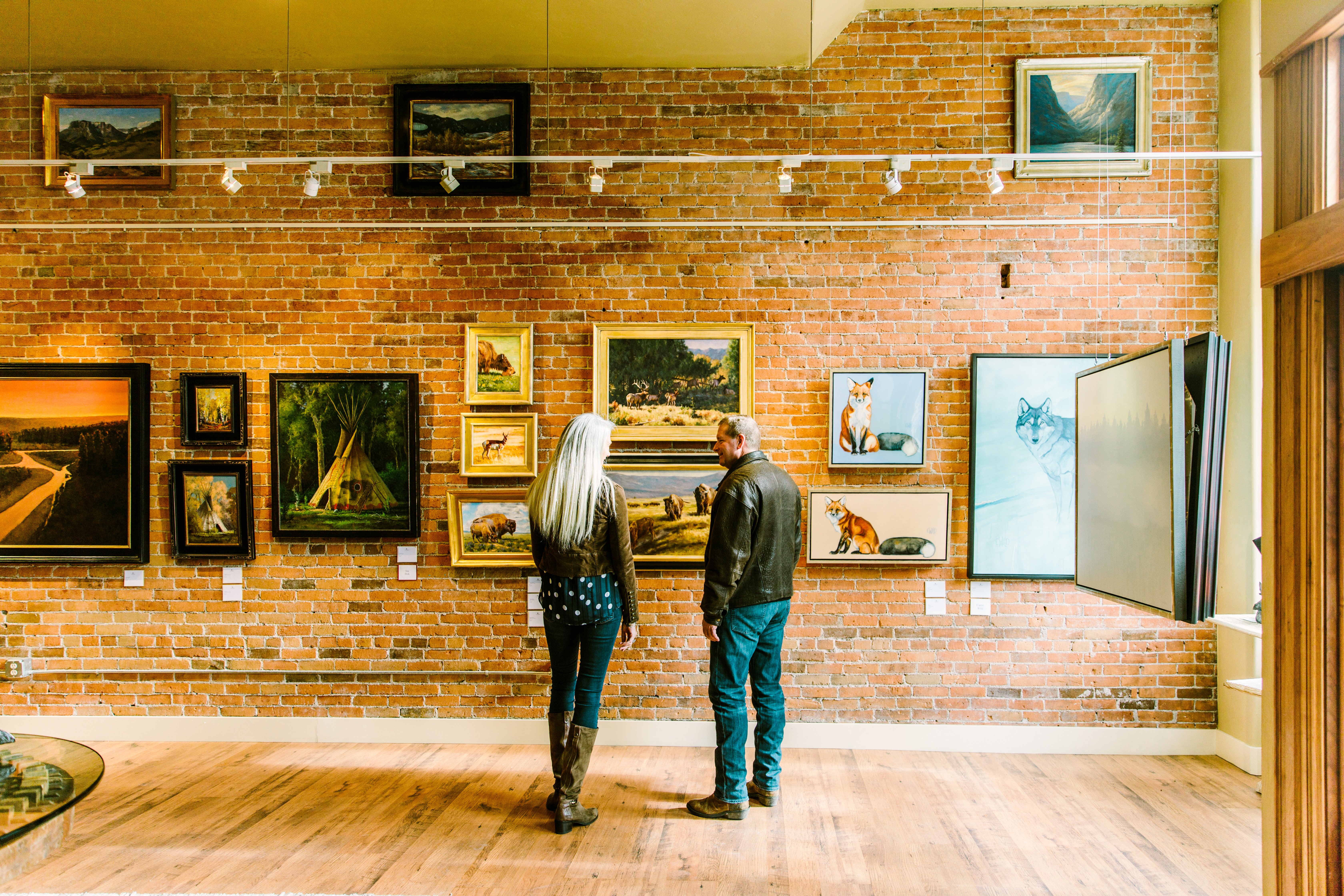 a couple viewing art at a gallery in Bozeman