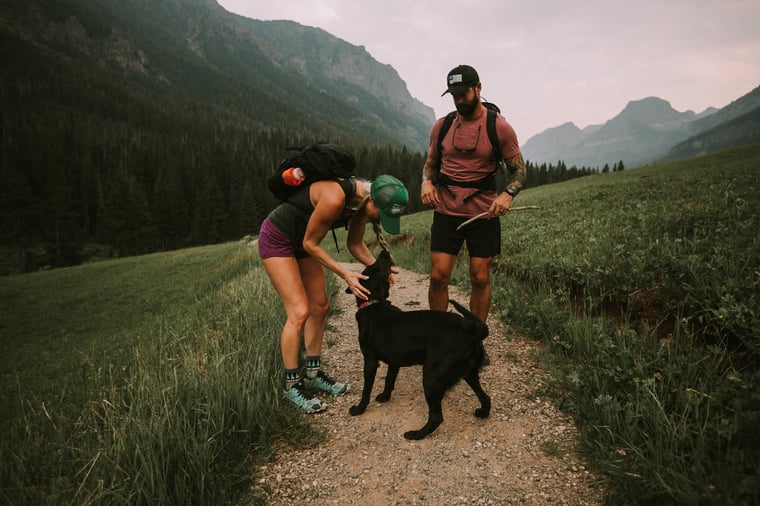 a couple hiking in Bozeman with their dog