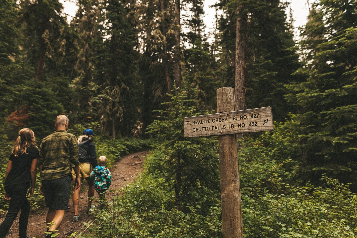 family hiking along Hyalite Creek Trail to Hyalite Peak