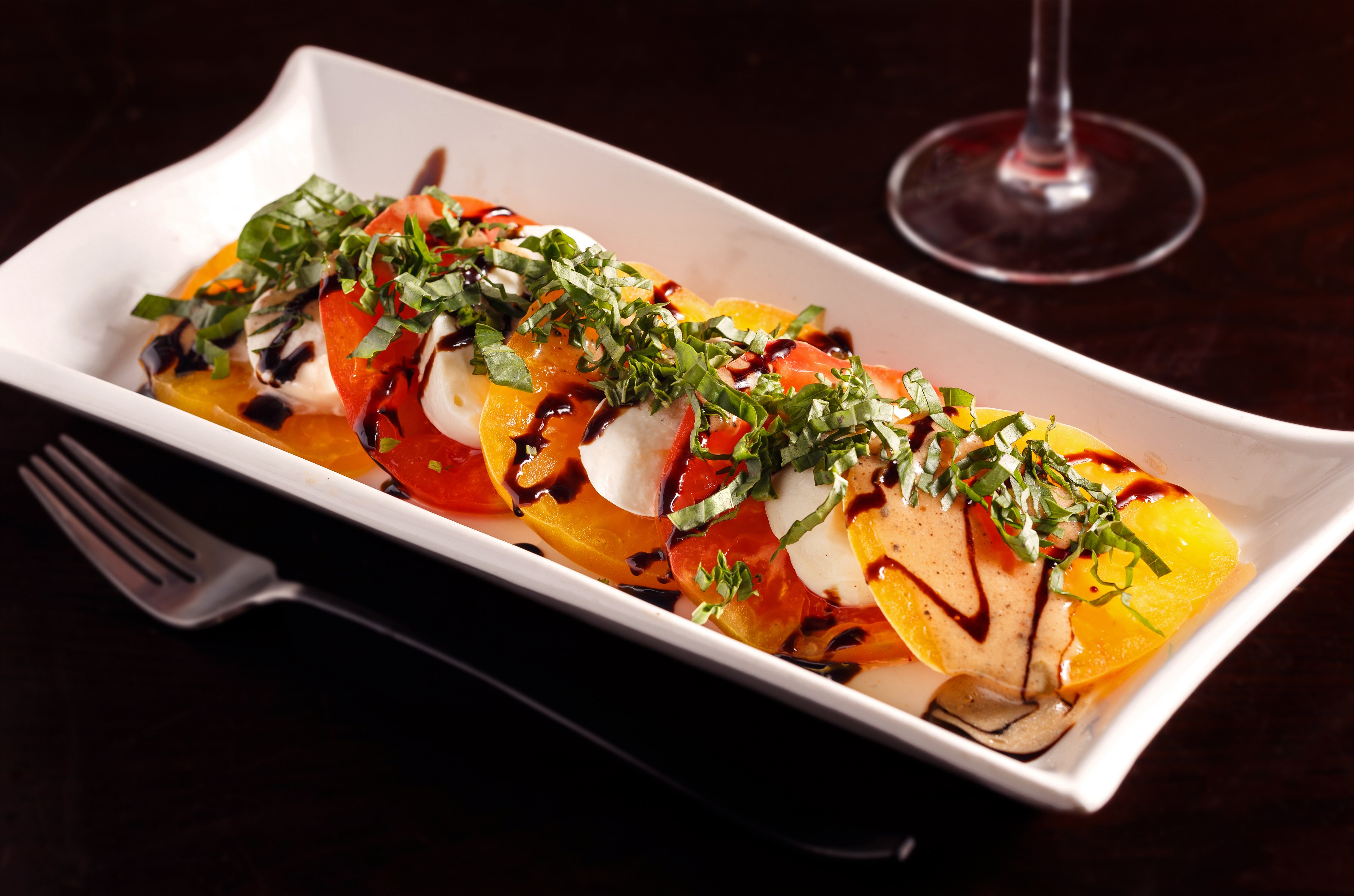 caprese salad with heirloom tomato at Blacksmith Italian