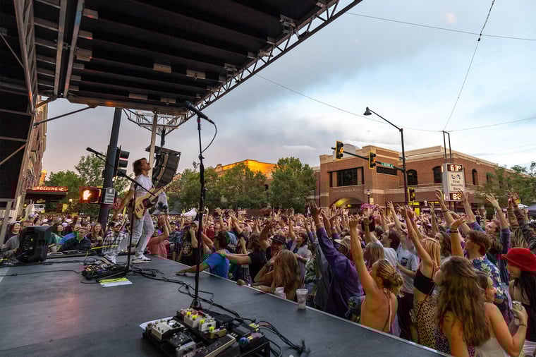 An artist performing on an outdoor stage during Music on Main in Bozeman, Montana. 