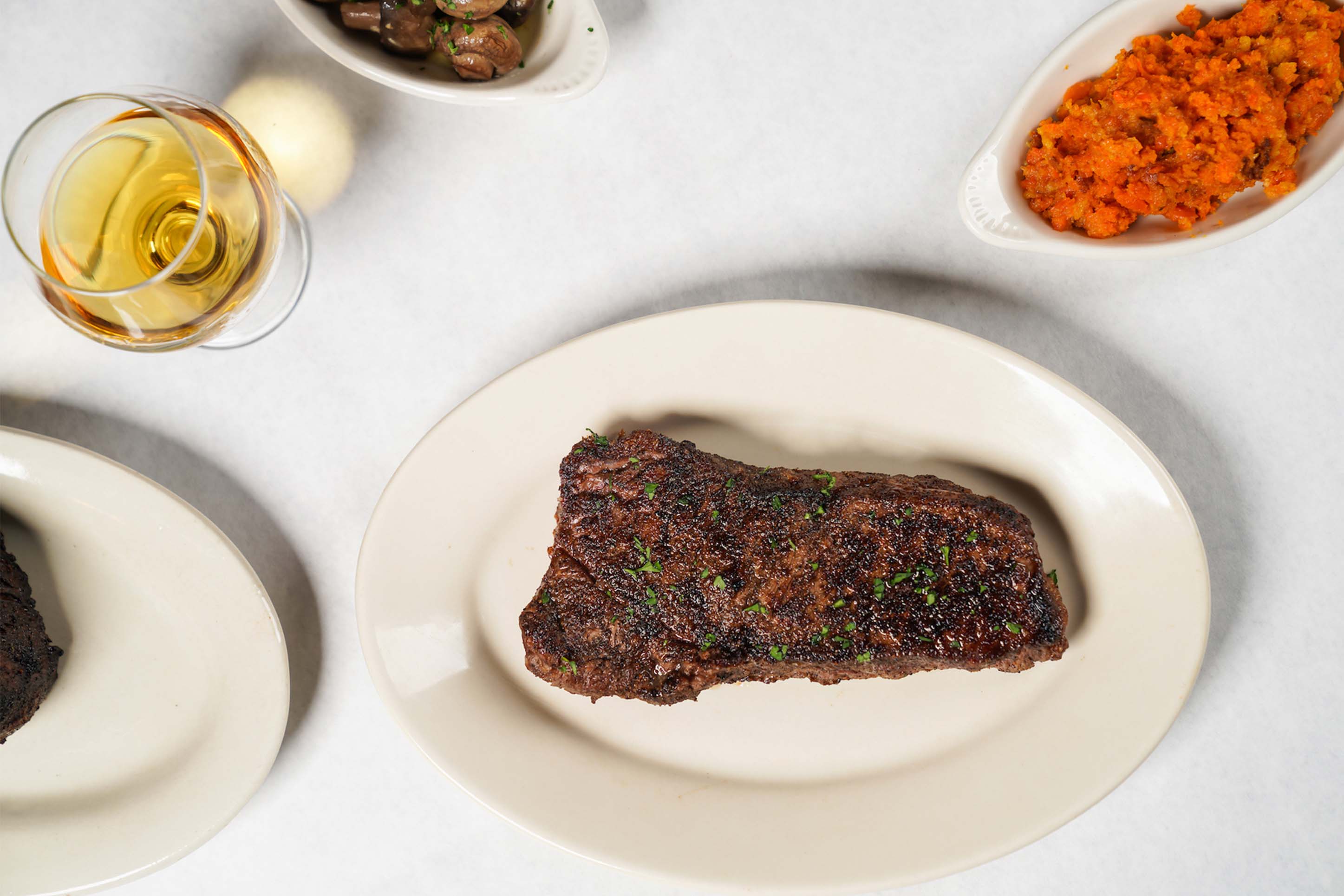 steak with wine and sweet potatoes at Bozeman's Rib and Chop House