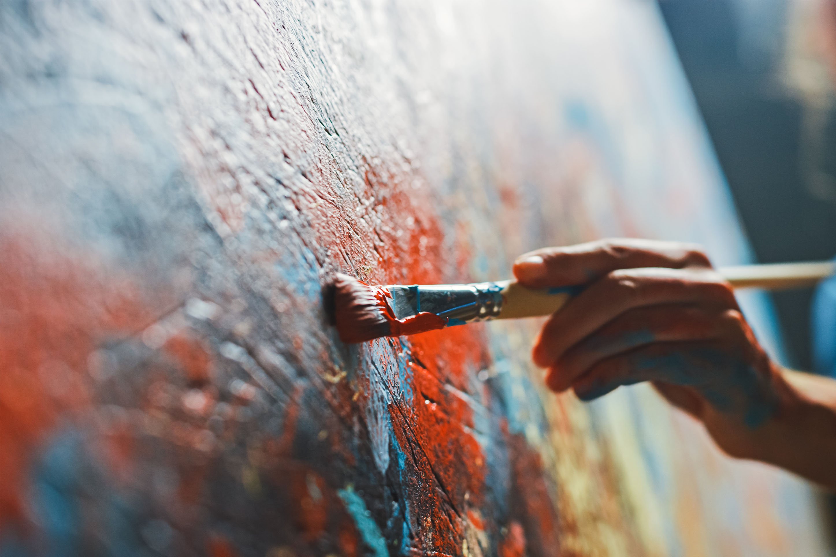 Photo of someone painting. 