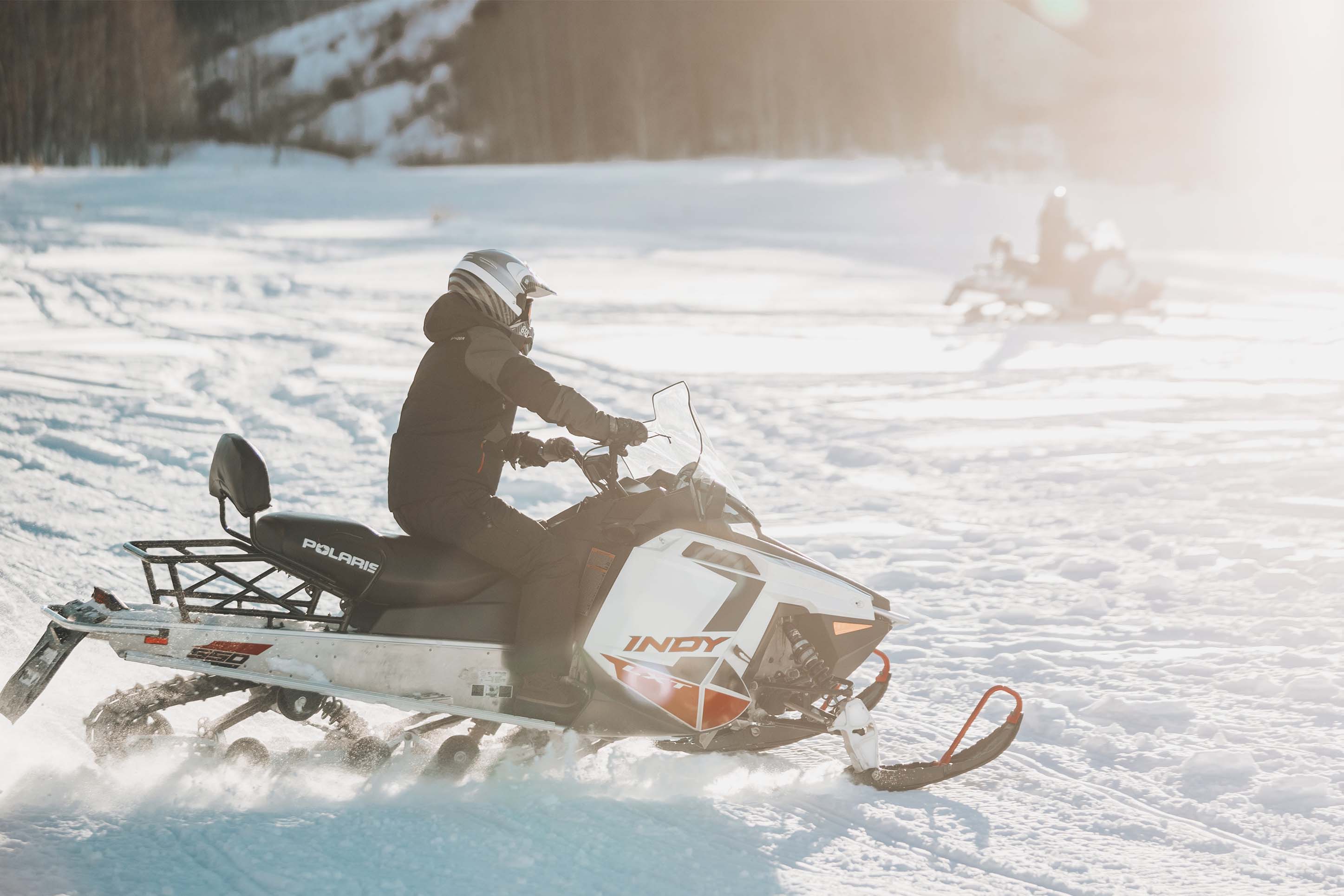 guy riding on a snowmobile in Bozeman, Montana