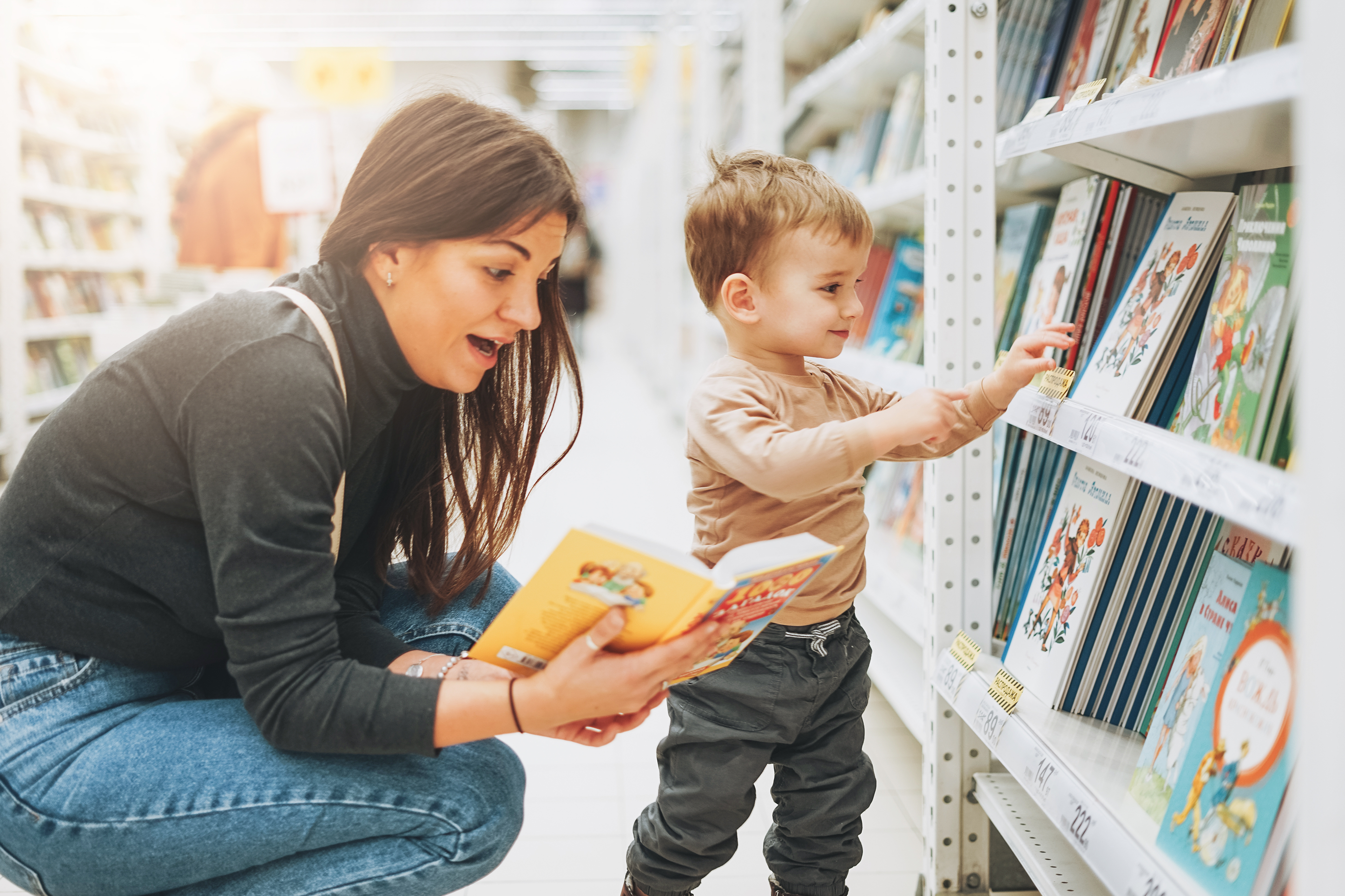 mother and son looking at children's books