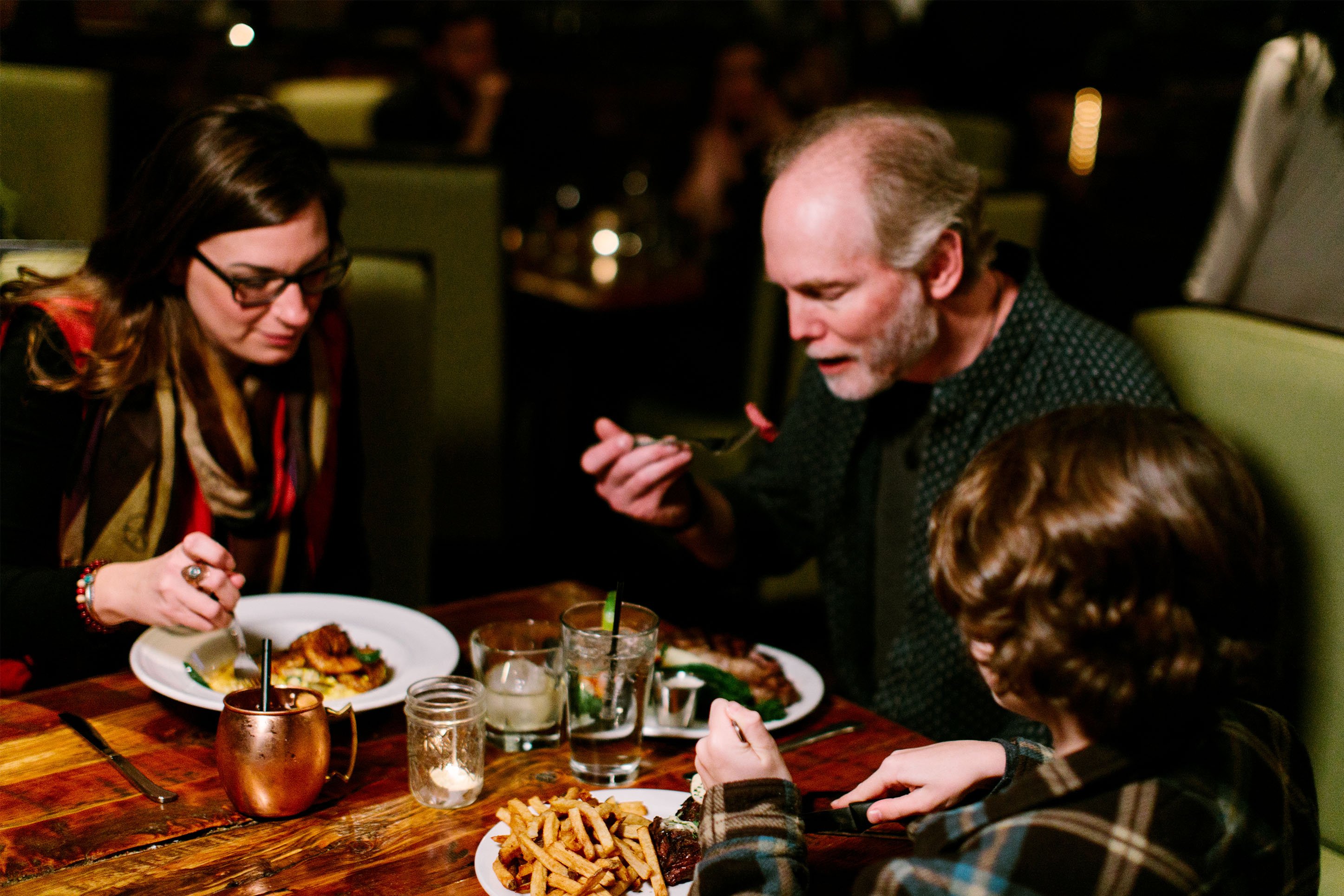 Family eating dinner at a restaurant. 