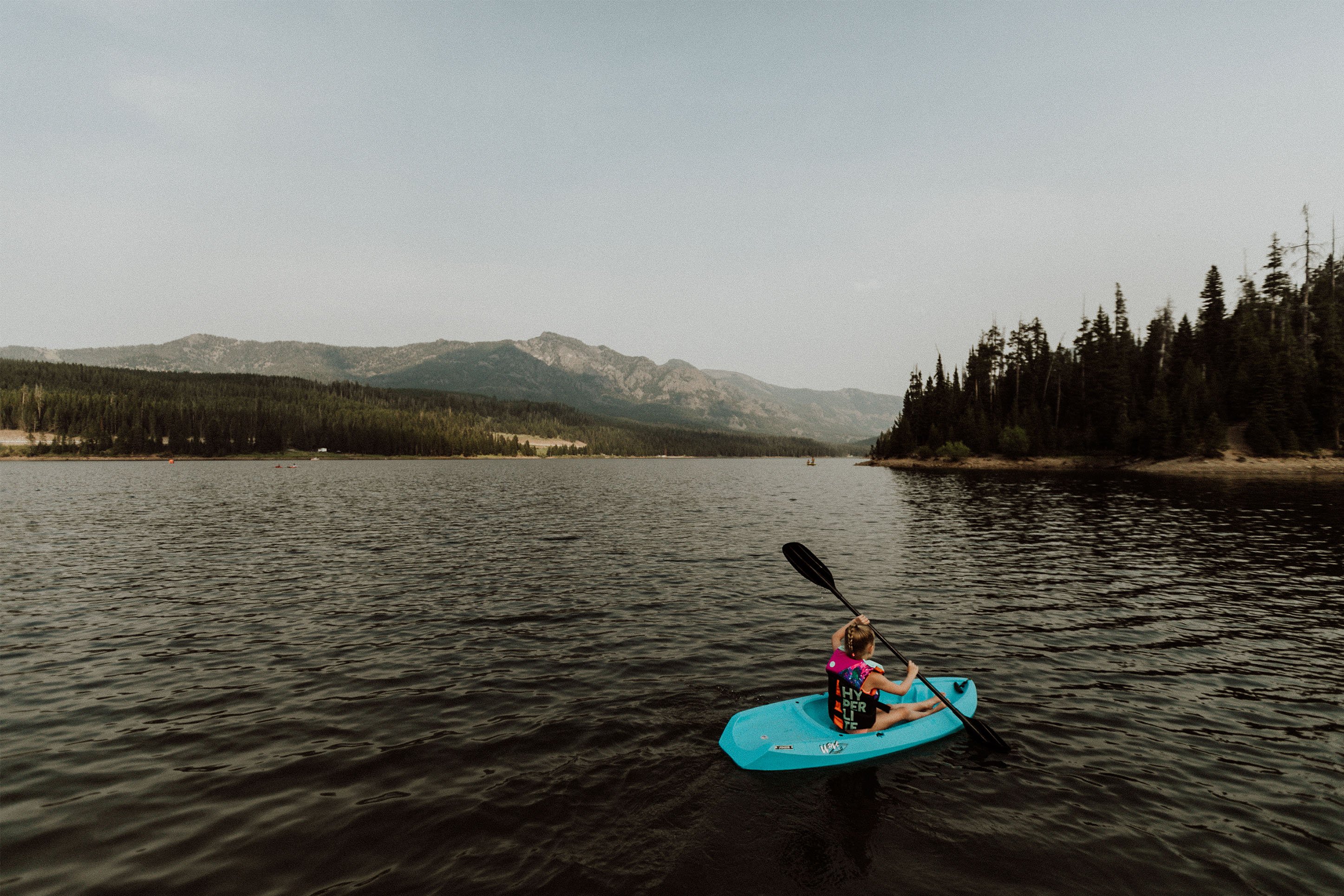 Child kayaking on Hyalite Reservoir