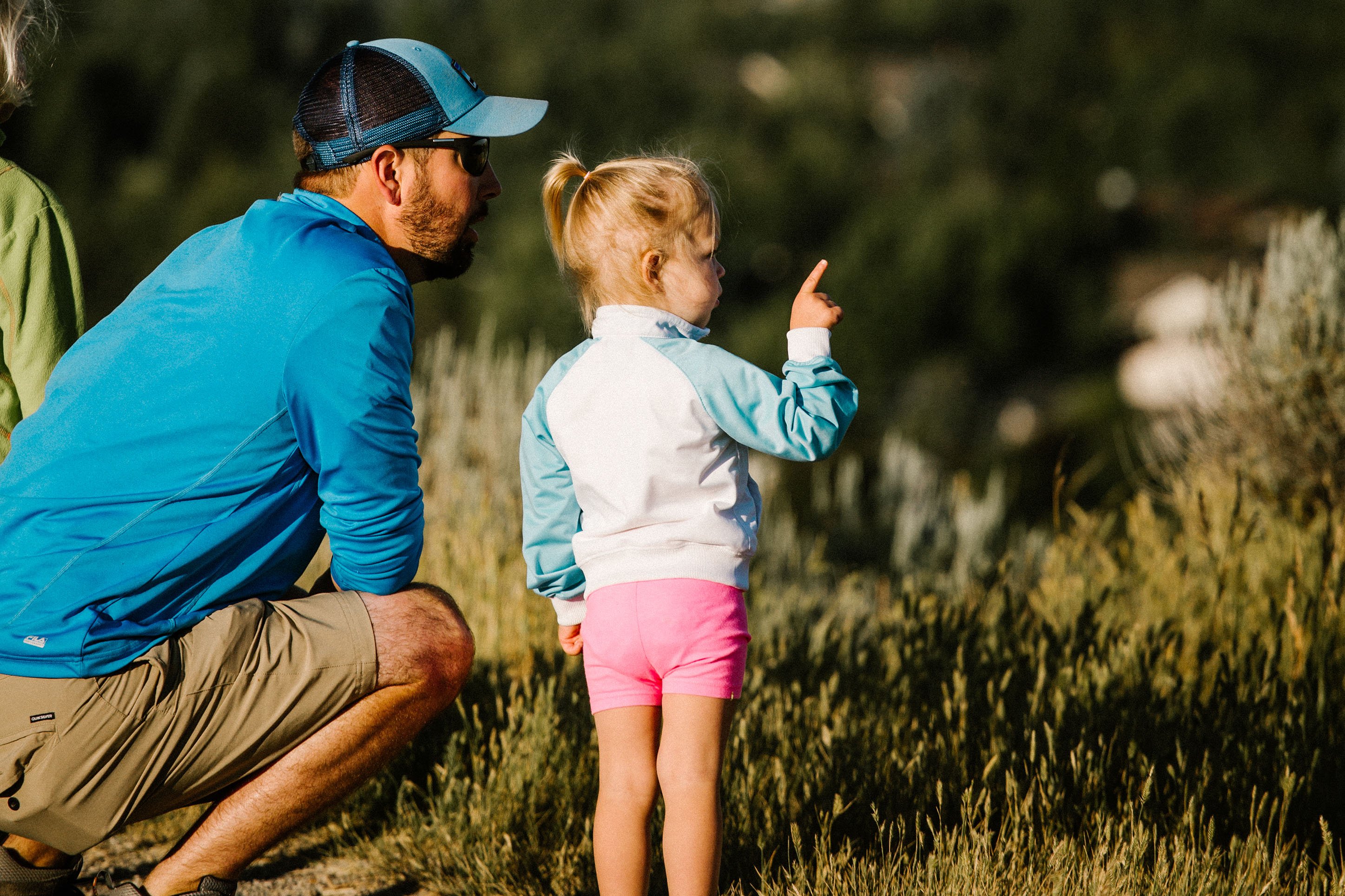 dad and little girl exploring the outdoors. 