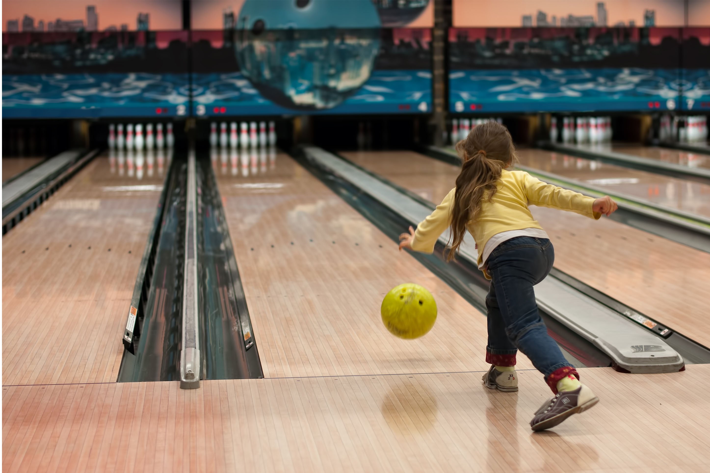 Little girl in bowling alley