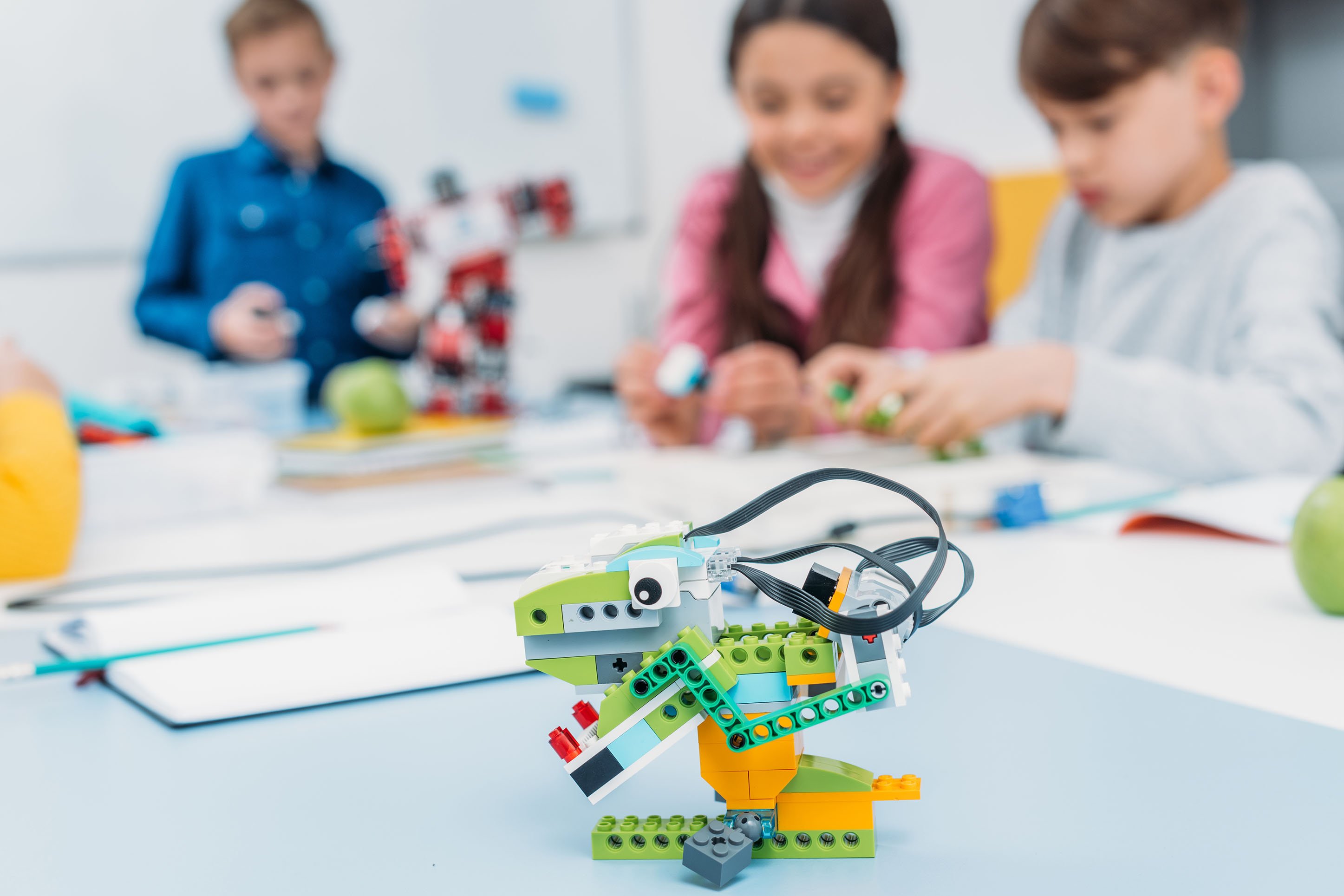 children playing with Lego robots at the Montana Science Center