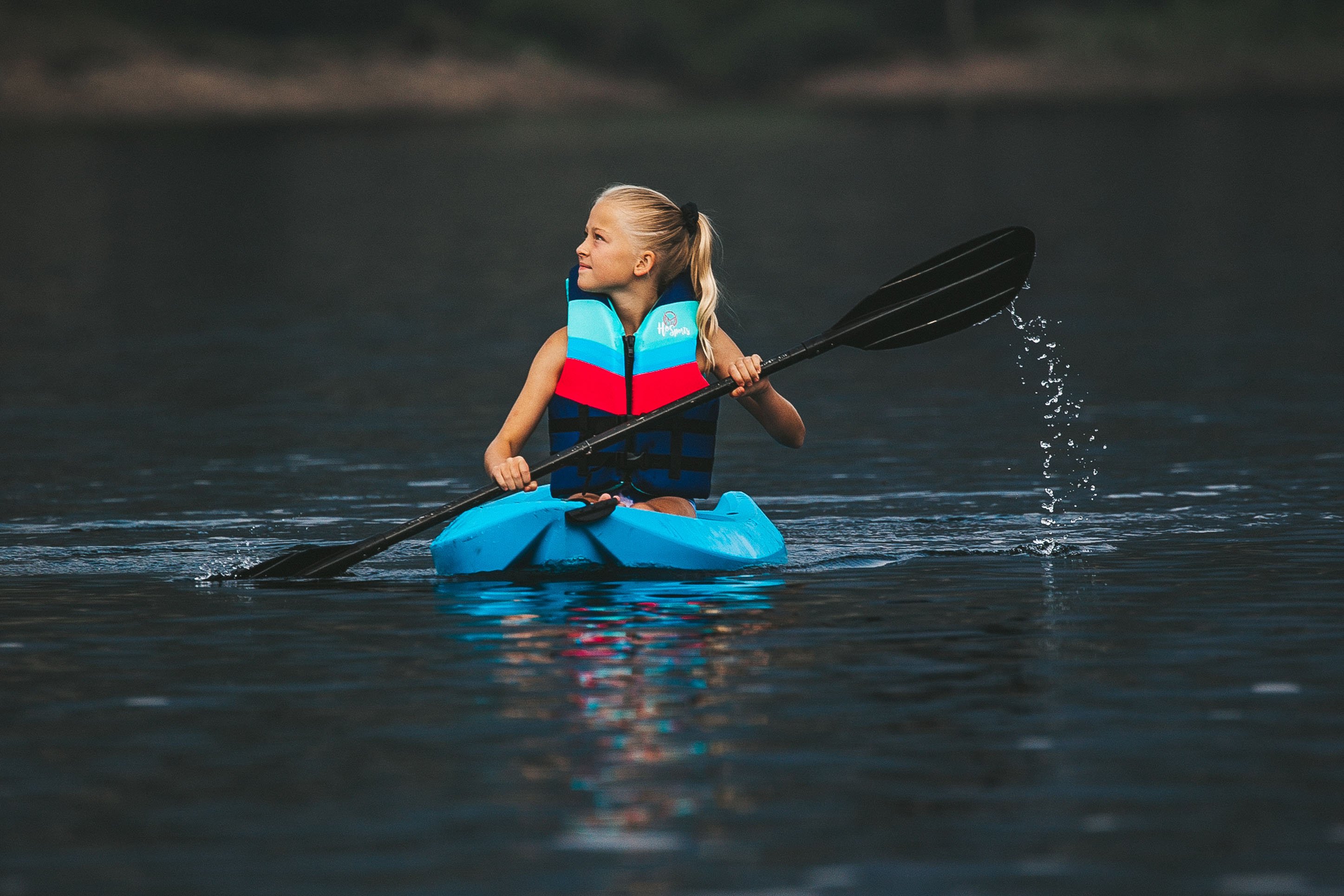 Girl canoeing on Quake Lake. 