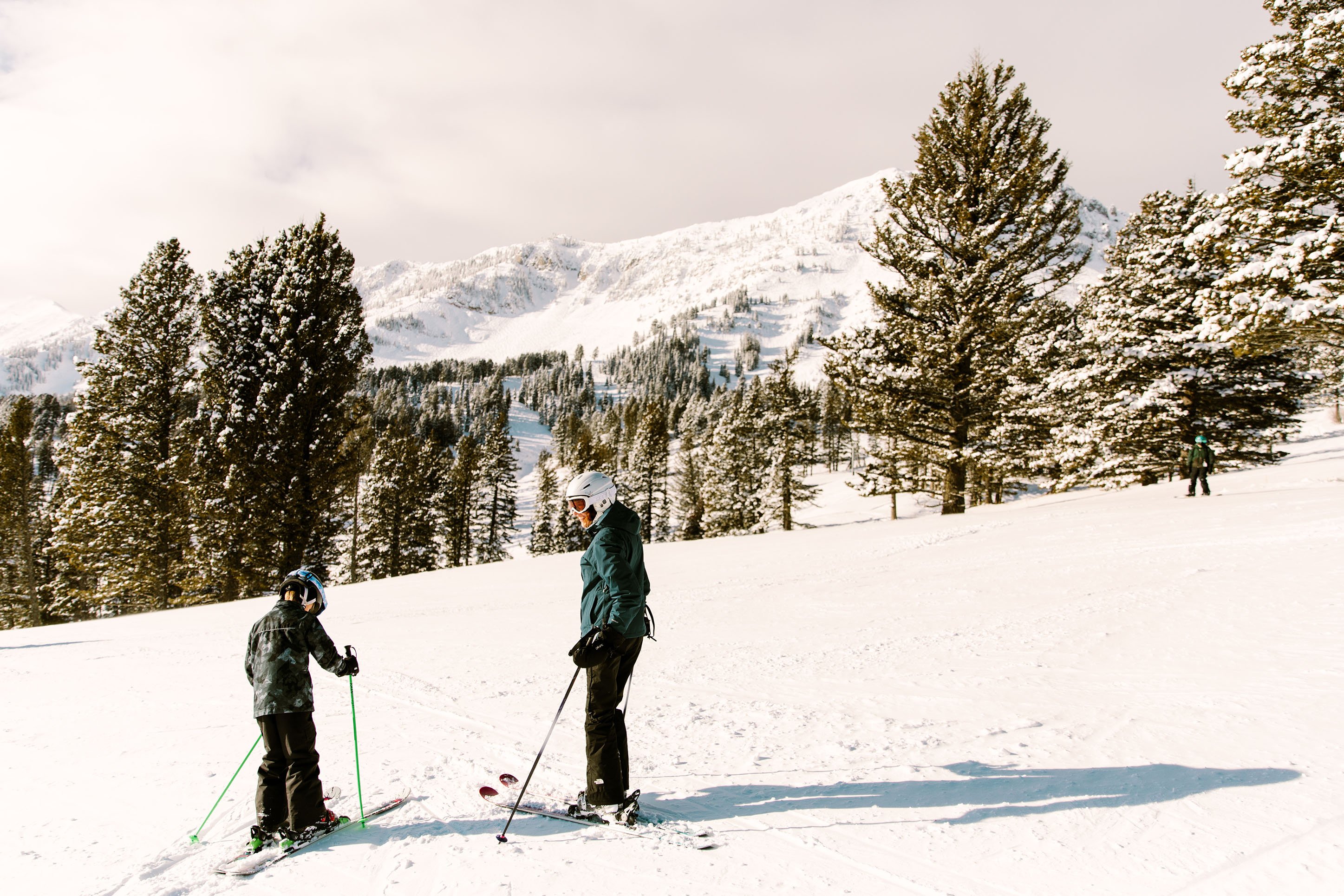 Mother and son skiing. 