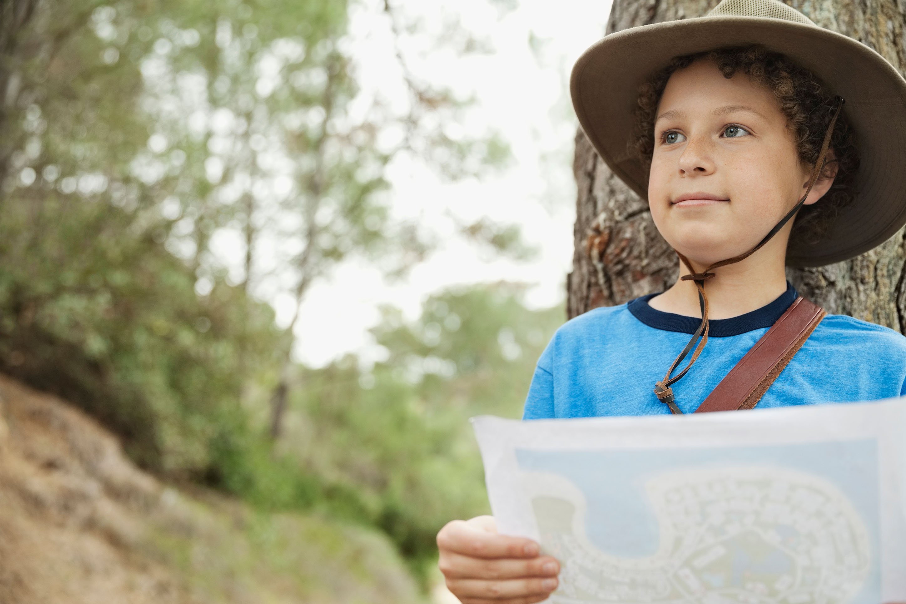 Young boy with a map to explore Yellowstone