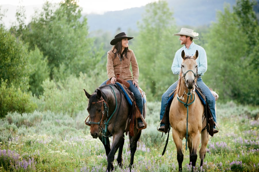 couple horseback riding in bozeman montana