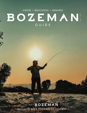 2025-2026 Visit Bozeman Travel Guide Cover: Man Fly Fishing