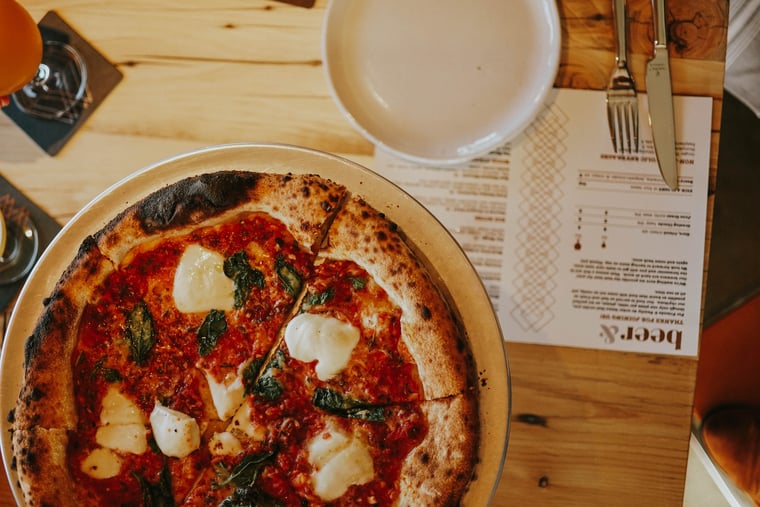 Pizza and beer menu on the table at Mountains Walking Brewery