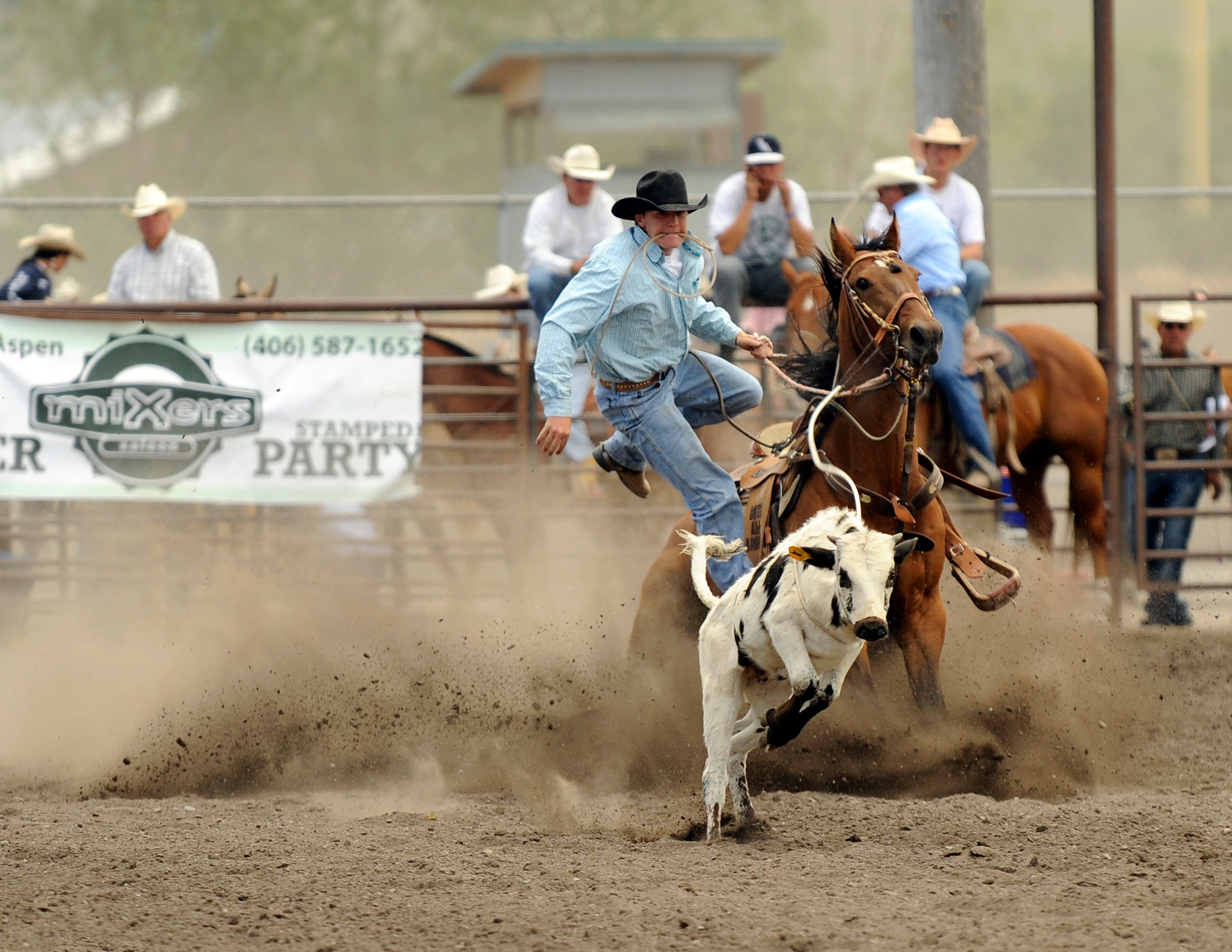 man steer wrestling in a rodeo