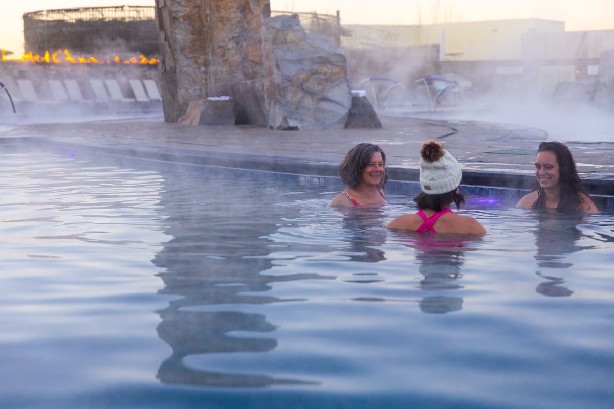 Photo of three women relaxing at Bozeman Hot Springs