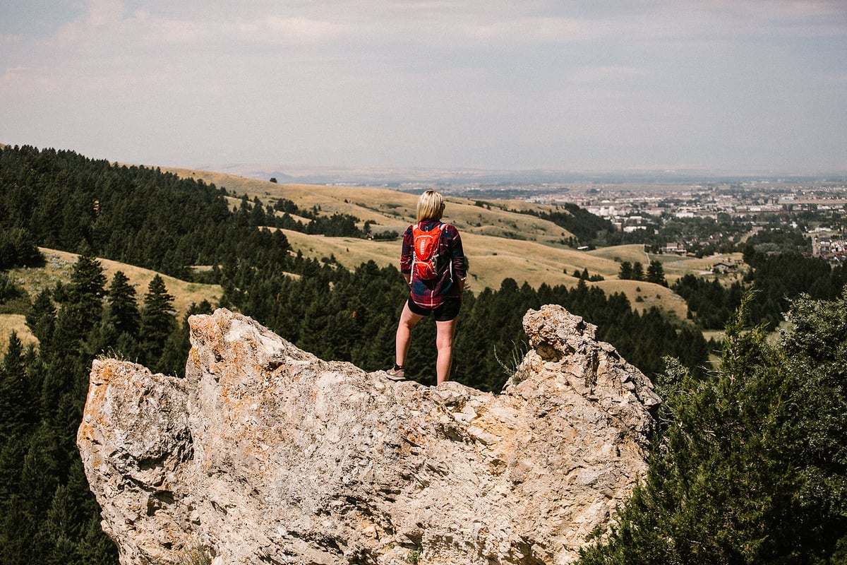 hiker overlooking the valley from the College M trail