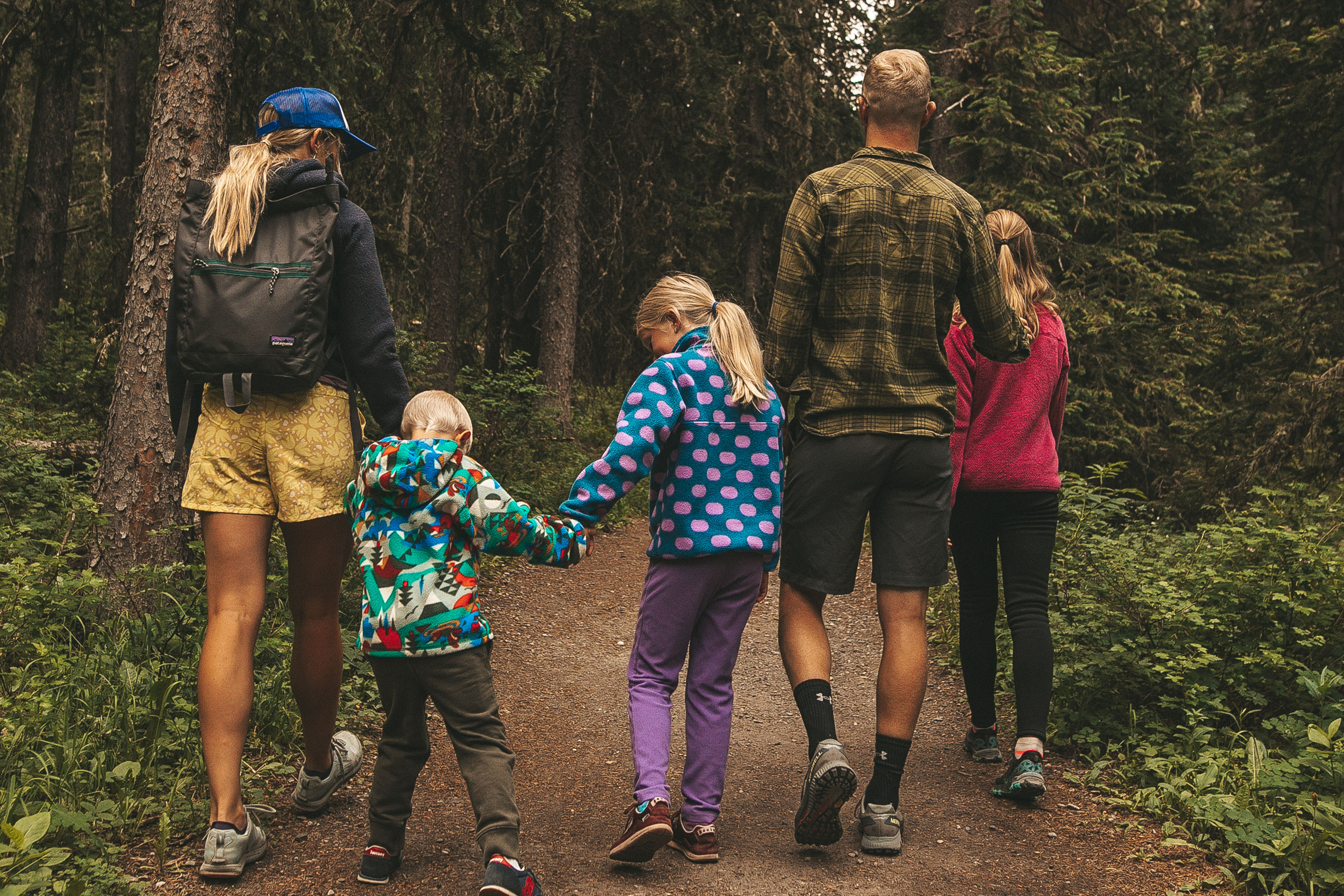 Family hiking together in the forest. 